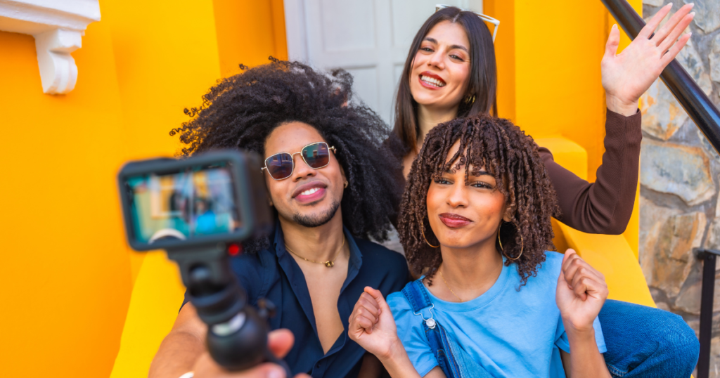 content creators filming a video blog with action camera